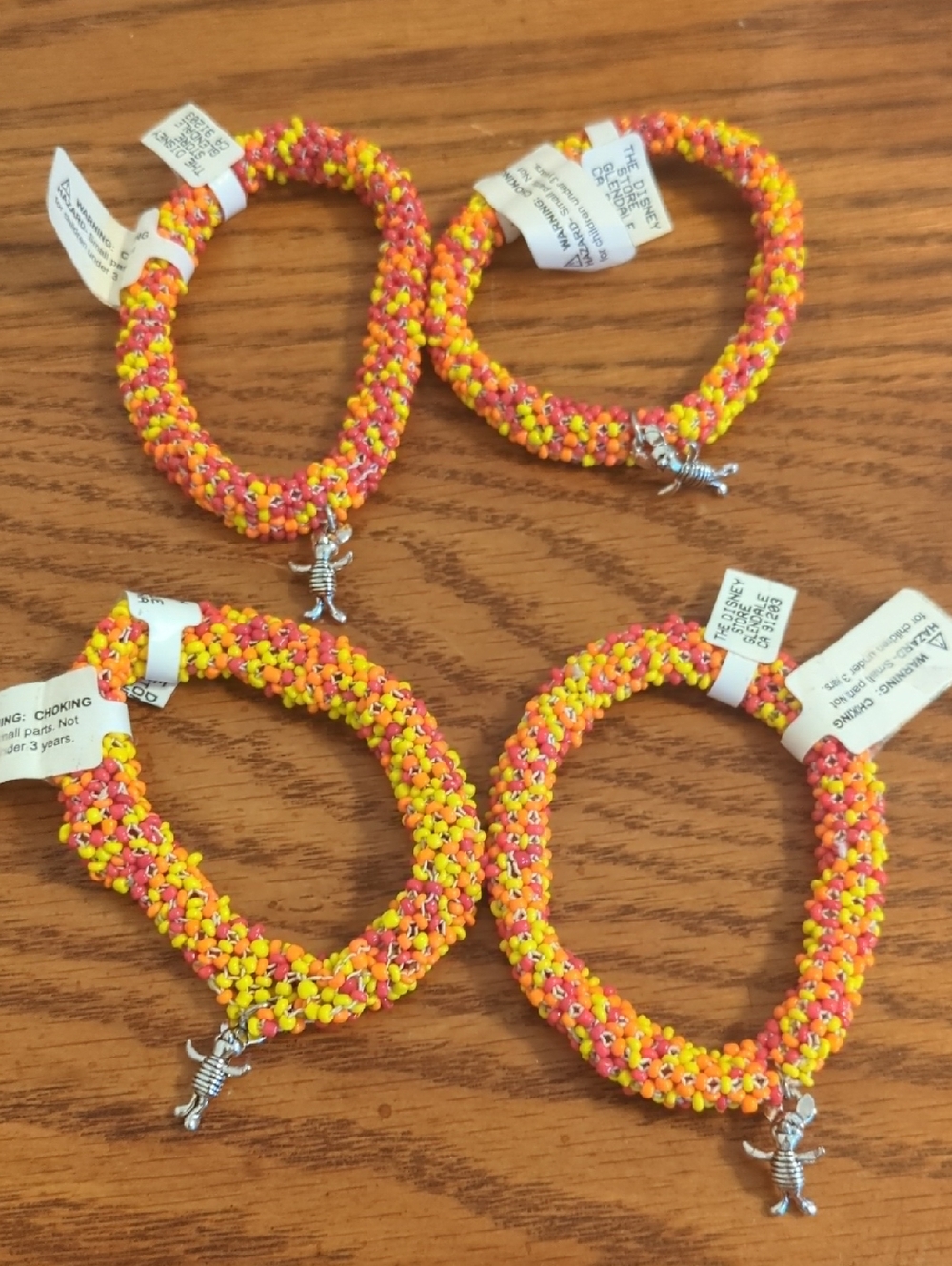 Lot Of 4 Orange, Yellow, Red Beaded Bracelet with Silver Piglet Charm